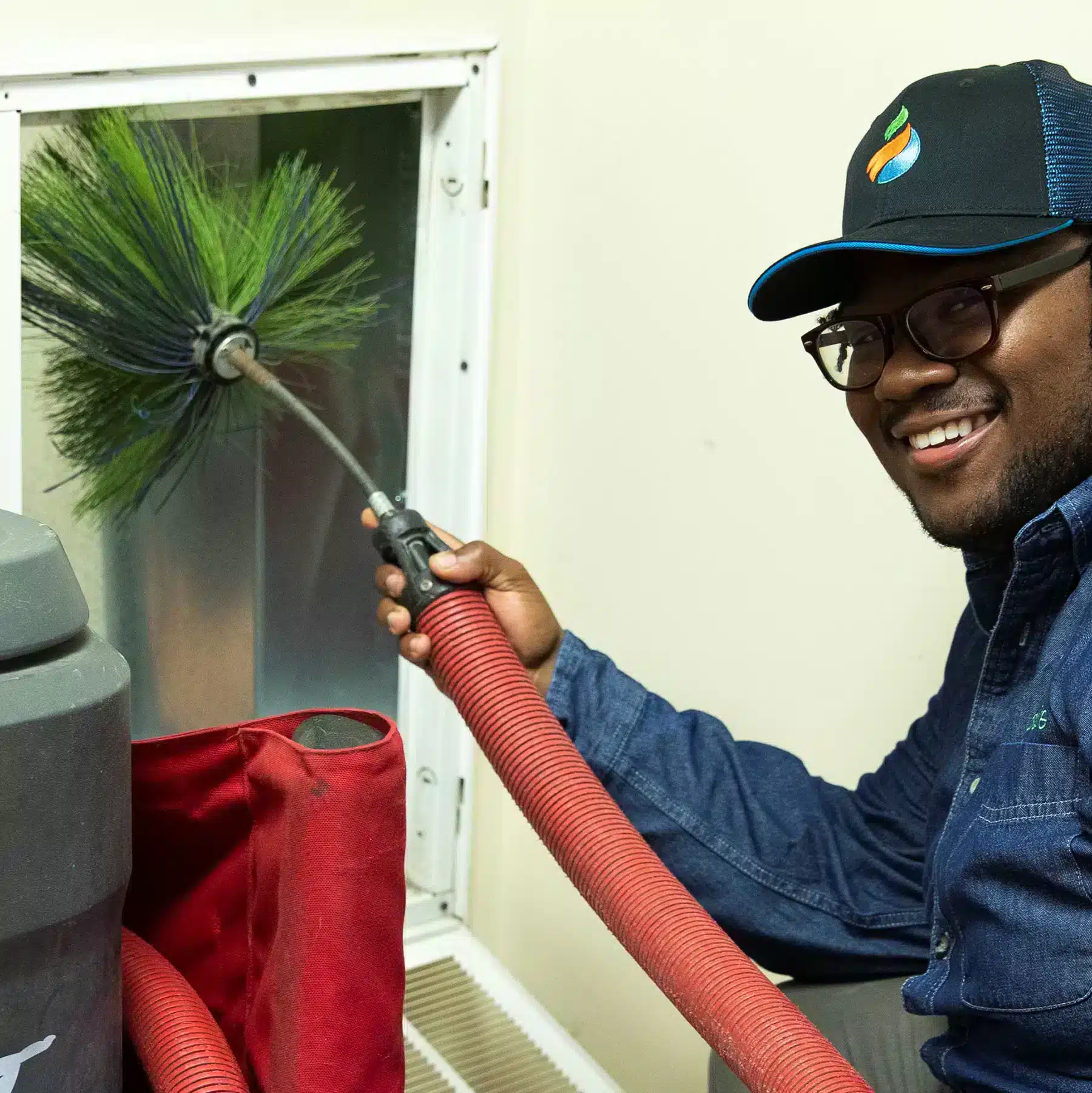 Absolute Heating & Air employee conducting duct cleaning services in Morgantown, WV