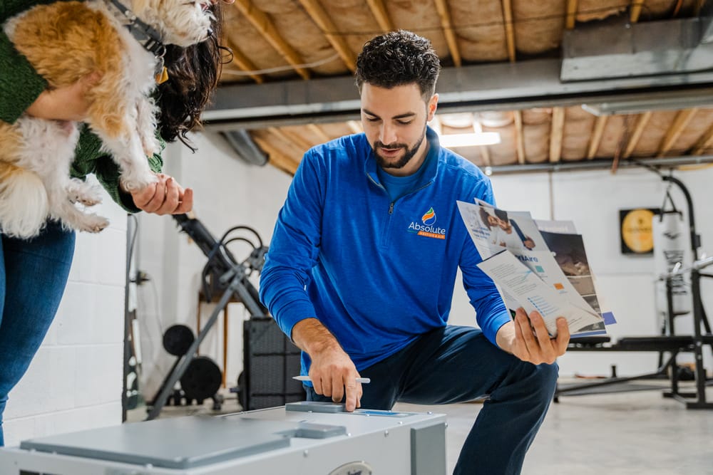 Technician installing air purification system.