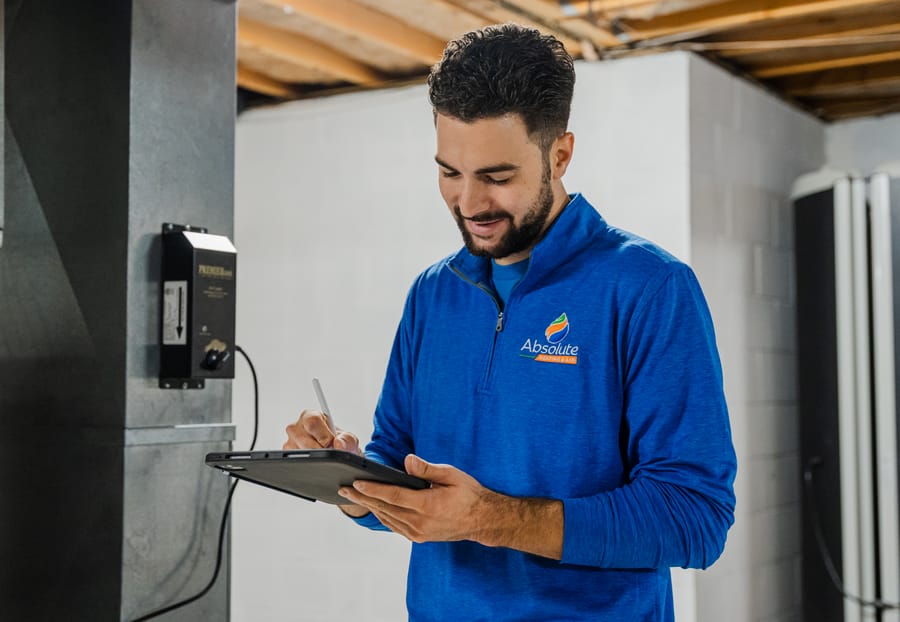 Absolute technician conducting dehumidifier service.