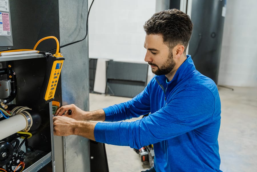 A technician installing heating system.