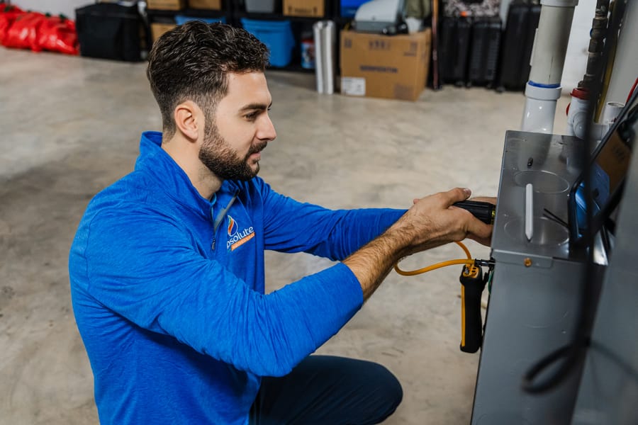 HVAC technician conducting heating repairs.