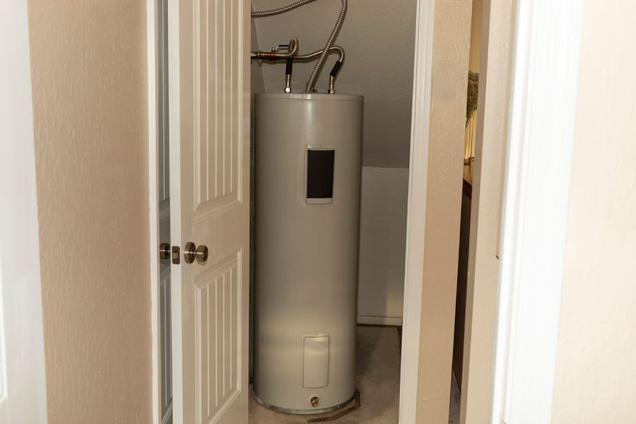 Standard water heater in a home's utility closet