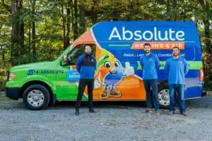 Absolute Air team in front of fleet truck.