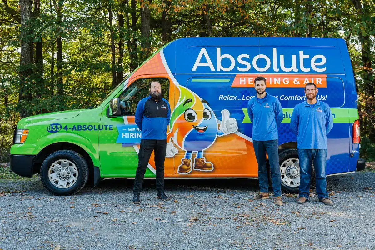 Absolute Air team in front of fleet truck.